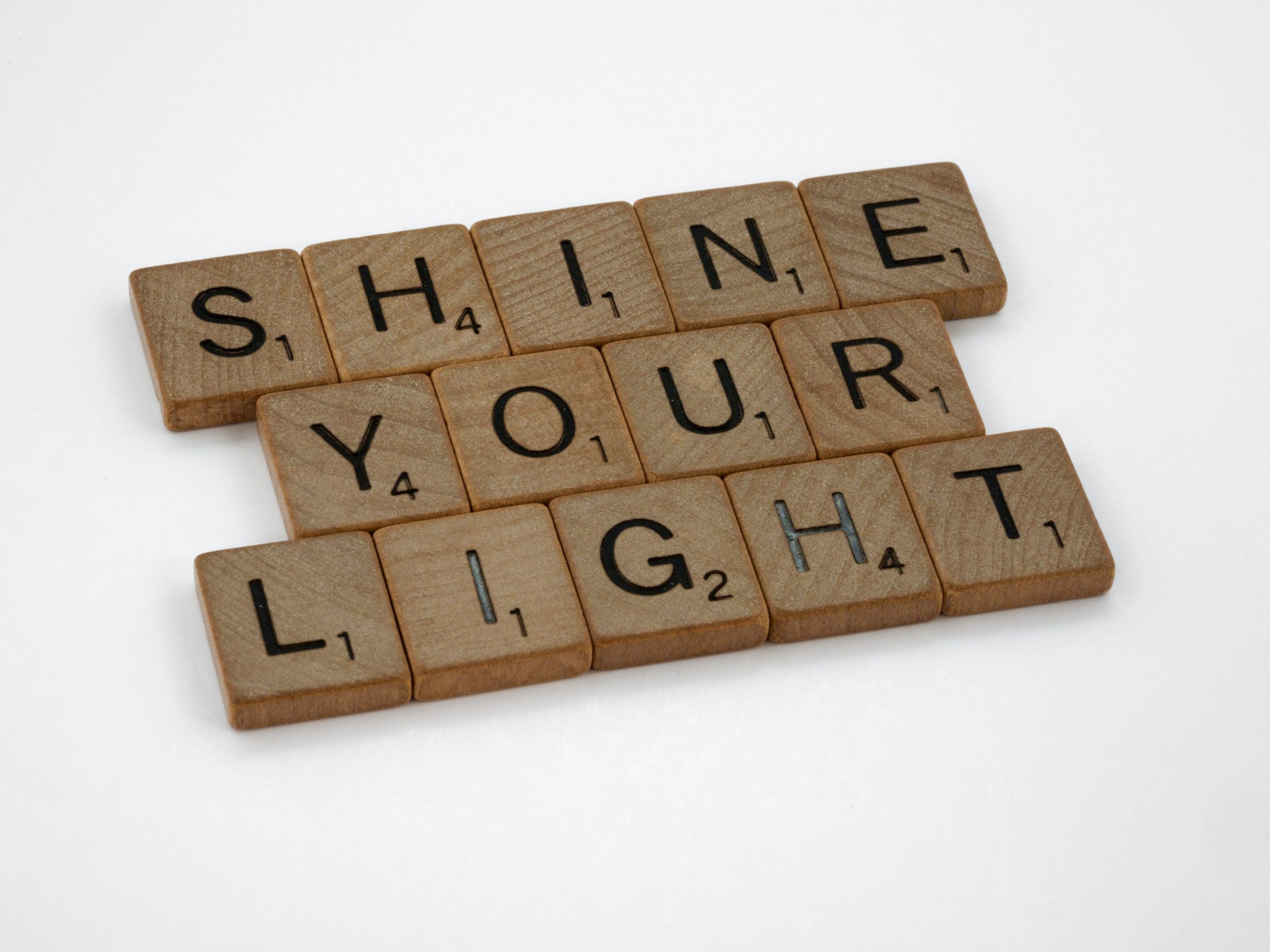 brett-jordan-9ZKAJ337aP4-unsplash scrabble letters spelling shine your light